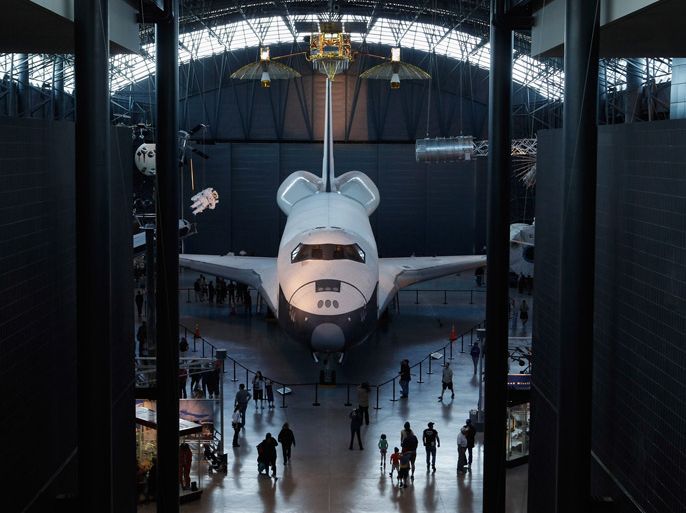 Chantilly, Virginia, UNITED STATES : CHANTILLY, VA - APRIL 17: The shuttle Enterprise sits the area in the Smithsonian National Air and Space Museum Steven F. Udvar-Hazy Center's McDonnell Space Hangar where space shuttle Discovery will be displayed, April 17, 2012 in Chantilly, Virginia. Without engines or a functional heat shield, Enterprise never flew in space and will be moved to the Intrepid Sea, Air & Space Museum in New York City next week. Discovery, the oldest and most traveled vehicle in NASA's space shuttle program, will be placed on permanent display at the museum. Chip Somodevilla/Getty Images/AFP== FOR NEWSPAPERS, INTERNET, TELCOS & TELEVISION USE ONLY