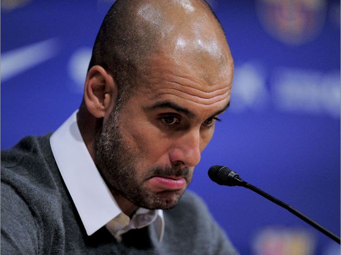 Barcelona's coach Josep Guardiola gives a press conference in Barcelona on April 27, 2012. Pep Guardiola is leaving the club, ending a four-year reign over one of the greatest eras in club football, the club president announced Today. Barcelona president Sandro Rosell made the announcement at a packed news conference in the Camp Nou alongside the 41-year-old coach. TOPSHOTS AFP PHOTO/ JOSEP LAGO