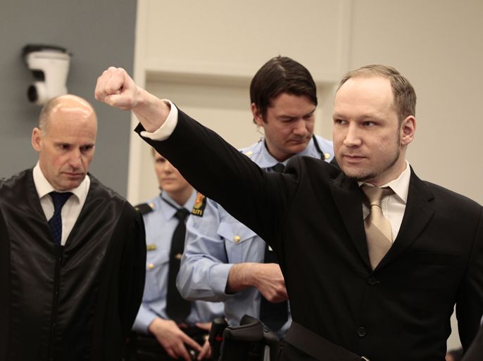 Rightwing extremist Anders Behring Breivik, who killed 77 people in twin attacks in Norway last year, makes a farright salute as he enters court in Oslo on April 16, 2012, for his trial which begins today. Right-wing extremist Anders Behring Breivik made a farright salute as he entered the Oslo district courtroom Monday, where he goes on trial for killing 77 people in twin attacks last July.