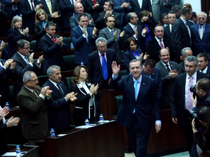 Turkey's Prime Minister Recep Tayyip Erdogan (C) gestures after an address to members of parliament from the ruling AK Party (AKP) at the Turkish parliament in Ankara on April 3, 2012. AFP