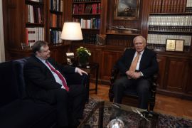 Greek Socialist Party leader Evangelos Venizelos (L) meets on May 12, 2012 with Greek President Carolos Papoulias (R) in his office in Athens. The leaders of the conservative, socialist and radical leftist parties, who all failed to form a government this week, will see Papoulias on May 13, and the president will subsequently meet with heads of smaller parties, including the neo-Nazi Golden Dawn, Papoulias' office said on May 12. AFP PHOTO/ POOL / ARIS MESSINIS