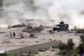 An image taken with a mobile phone allegedly shows an armed vehicle driving in Loder, in the restive southern Abyan province, as clashes continued between Al-Qaeda militants and the Yemeni army forces on May 16, 2012. Yemen's army, with the backing of US experts, is slowly gaining ground in its southern offensive against Al-Qaeda, diplomats and officials said as