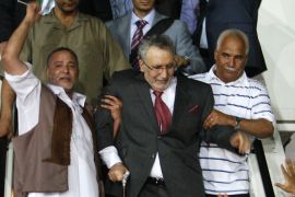 A handout file picture obtained from Oya newspaper shows Libyans greeting freed Lockerbie bomber Abdelbaset Ali Mohmet al-Megrahi (C), the sole Libyan convicted over the 1988 Pan Am jetliner bombing, upon his arrival in Tripoli late on August 20, 2009. Megrahi, the only person convicted over the