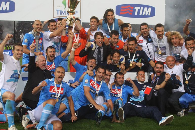 ROME, ITALY - MAY 20: Players of SSC Napoli celebrate with the trophy after winning the Tim Cup final match against Juventus FC at Olimpico Stadium on May 20, 2012 in Rome, Italy. (Photo by Paolo Bruno/Getty Images)