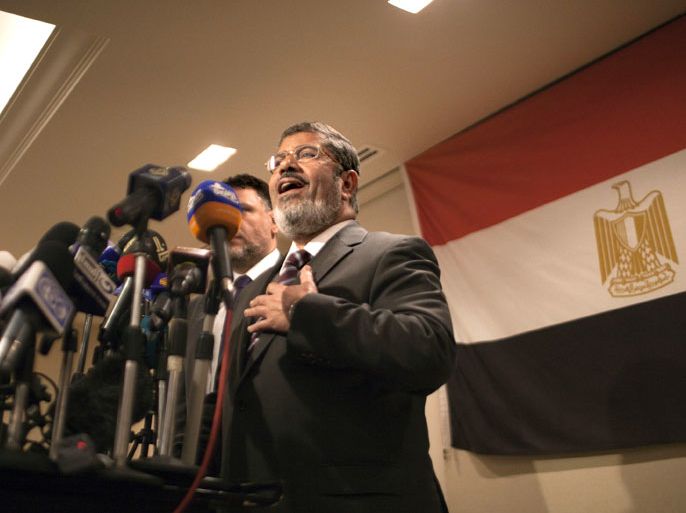 Muslim Brotherhood Egyptian presidential candidate Mohammed Mursi gives a press conference in Cairo on May 26, 2012. The Muslim Brotherhood today urged Egyptians to rally behind their presidential candidate in an almost certain run-off with rival Ahmed Shafiq, warning the country would be in danger if fallen dictator Hosni Mubarak's premier wins. AFP PHOTO/MARCO LONGARI