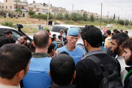 The Chief of the U.N. Supervision Mission to Syria, Norwegian Major General Robert Mood (C), talks with residents of the Arabaeen district in the Syrian city of Hama during the United Nations observers' visit to Hama, May 3, 2012. The United Nations is accelerating deployment of unarmed observers to Syria to ensure all 300 are on the ground by the end of May to monitor a shaky U.N.-backed ceasefire, U.N. peacekeeping chief Herve Ladsous said on Tuesday. REUTERS