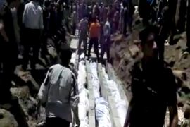 epa03238039 A grab made from a video published by Sham News Network on a social network on 26 May 2012, shows bodies of Syrians killed one day earlier being made ready for a mass funeral in Houla, Homs, Syria. Syrian authorities categorically denied on 27 may 2012, any responsibility for the Syrian forces in the 'massacre' that took place a day earlier in the Houla villages in the central city of Homs and which claimed the lives of more 90 people, including 32 children. Syria's state media 27 May said that groups linked to al-Qaeda were behind the massacre in the town of Houla where UN observers confirmed that 92 people, including 32 children, died. 'Terrorist groups from al-Qaeda committed two heinous massacres against families in the countryside of Homs (in central Syria),' the state news agency SANA said, quoting an unnamed official in the area.