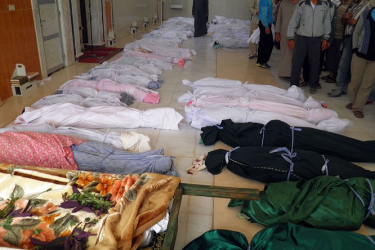 handout image released by the Syrian opposition's Shaam News Network on May 26 , 2012, shows the bodies of killed people made ready for burial in the town of Houla. The head of a UN mission warned of "civil war" in Syria