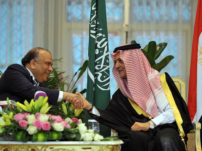 Saudi Foreign Minister Prince Saud al-Faisal (R) shakes hands with Egypt's parliament speaker Saad al-Katatni (L) during their meeting in Riyadh on May 03, 2012. AFP PHOTO/FAYEZ NURELDINE