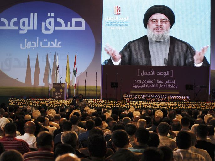 Secretary General of Hezbollah Sayyed Hassan Nasrallah speaks via a giant screen during the celebration of 'the promise of the most beautiful' on the occasion of the conclusion of the 'Project Promise' for the reconstruction of buildings southern suburbs, in the former security square which was destroyed during the July 2006 Israeli war,