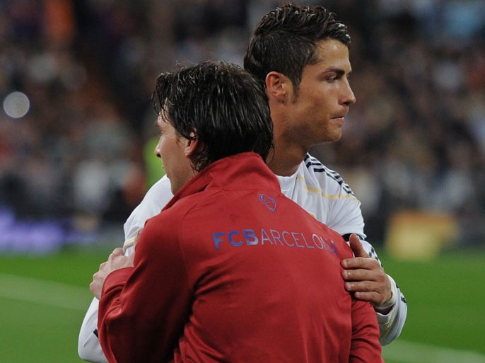 MADRID, SPAIN - APRIL 10: Lionel Messi (L) of FC Barcelona greets Cristiano Ronaldo of Real Madrid prior to the start of the La Liga match between Real Madrid and Barcelona at the Estadio Santiago Bernabeu on April 10, 2010 in Madrid, Spain. Barcelona won the match 2-0. (Photo by Jasper Juinen/Getty Images)