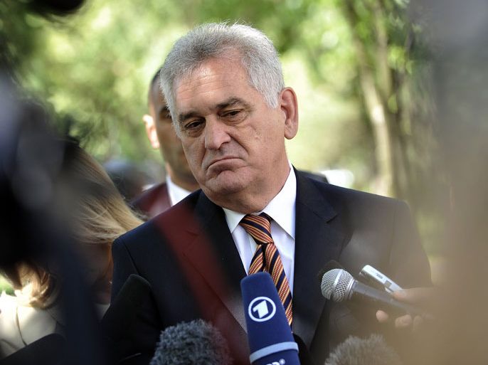 AND015 - BELGRADE, -, SERBIA : (FILES) A file picture taken on May 6, 2012 shows Serbian nationalist leader Tomislav Nikolic, addressing the media in front of a polling station in Belgrade. Serbian nationalist leader Tomislav Nikolic, who faces incumbent president Boris Tadic in a May 20 presidential run-off, on May 10 accused his rival of election fraud, Beta news agency reported. Nikolic showed reporters a bag he claimed was filled with ballot papers from one polling station in Sunday's election that were found in the trash. AFP