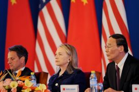US Treasury Secretary Timothy Geithner (L), US Secretary of State Hillary Clinton (C) and Chinese Vice-Premier Wang Qishan (R) attend the joint statment reading for the closing of the US-China Strategic and Economic Dialogue at the Diaoyutai Guesthouse in Beijing on May 4, 2012. China said that blind activist Chen Guangcheng can apply to study abroad, offering a possible resolution to a crisis that erupted when he escaped house arrest and fled to the US embassy. The apparent concession came after Chen said he was in "great danger" and urged China's government to honour guarantees on his safety