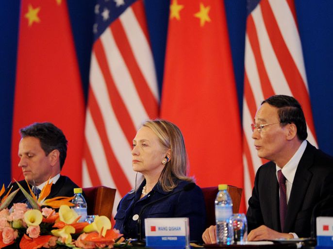 US Treasury Secretary Timothy Geithner (L), US Secretary of State Hillary Clinton (C) and Chinese Vice-Premier Wang Qishan (R) attend the joint statment reading for the closing of the US-China Strategic and Economic Dialogue at the Diaoyutai Guesthouse in Beijing on May 4, 2012. China said that blind activist Chen Guangcheng can apply to study abroad, offering a possible resolution to a crisis that erupted when he escaped house arrest and fled to the US embassy. The apparent concession came after Chen said he was in "great danger" and urged China's government to honour guarantees on his safety