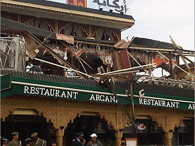 police work after a powerful blast said to be of criminal origin killed 14 people, 11 foreigners and 3 moroccan people in a cafe in the centre of the moroccan tourist city of marrakesh on april 28, 2011 (الفرنسية)