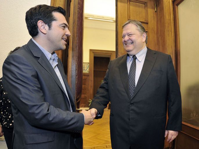 Greece's radical leftist party Syriza chief Alexis Tsipras (L) shakes hands with Socialists leader Evangelos Venizelos before their meeting at the Greek parliament in Athens on may 11, 2012