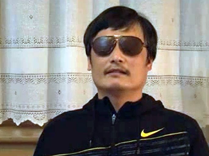 An image grab taken from a video uploaded on YouTube on April 27, 2012 shows Chen Guangcheng, a blind Chinese lawyer, speaking following his escape from house arrest in Beijing. Guangcheng confirmed his dramatic escape from house arrest and appealed to Premier Wen Jiabao to keep his family safe, in a video posted online on April 27. AFP PHOTO/YOUTUBE ---RESTRICTED TO EDITORIAL USE - MANDATORY CREDIT "AFP