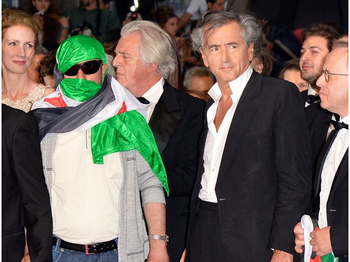 epa03235492 French philosopher and director Bernard Henry Levy (R) and a Syrian dissident (L) arrive for the screening of 'Cosmopolis' during the 65th Cannes Film Festival, in Cannes, France, 25 May 2012. The movie is presented in the Official Competition of the festival, which runs from 16 to 27 May. EPA/STEPHANE REIX