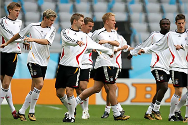 REUTERS /German national soccer team players warm up during a training session at the Allianz Arena stadium in Munich June 8, 2006. The team will play against Costa Rica in the opening