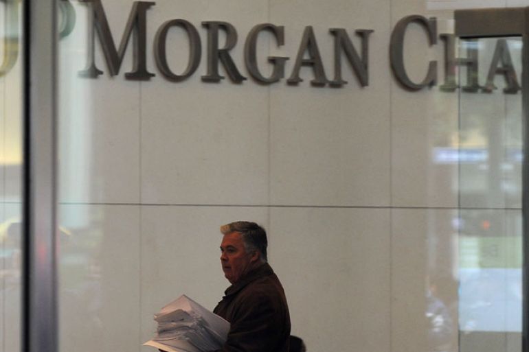 protesters epa02983949 A JP Morgan Chase employee carries in letters delivered by