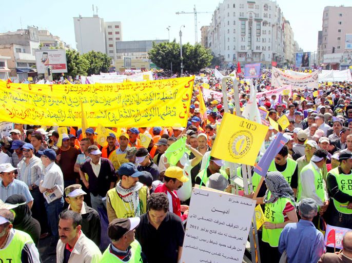 People take part in a demonstration gathering thousands, including Islamists, to demand greater political reforms and social justice, in Casablanca on May 27, 2012. AFP PHOTO