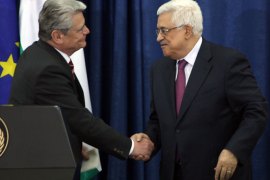 German President Joachim Gauck (L) shakes hands with his Palestinian counterpart Mahmud Abbas following a meeting in the West Bank city of Ramallah on May 31, 2012 a day after the former asked Israeli Prime Minister Benjamin Netanyahu for a gesture on the issue of West Bank settlements, which the international community define as illegal. AFP PHOTO/ABBAS MOMANI