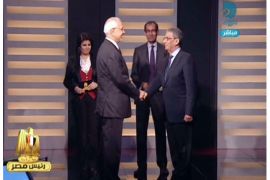 An image grab taken from the private Egyptian Dream TV channel shows hopeful presidential candidates, the moderate Islamist, Abdelmoneim Abul Fotouh (L) and former Arab League General Secretary, Amr Mussa (R) shaking hands as they attend their live debate in Cairo on May 10, 2012. Egypt is set to hold its first ever debate between presidential candidates on Thursday when two frontrunners for this month's election duel it out on television. AFP