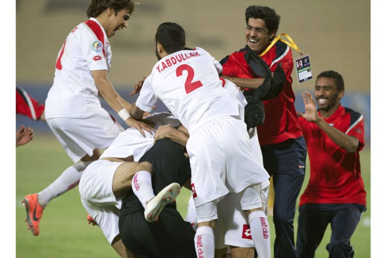 Players of Kuwait SC celebrate their winning AFC Cup round 16 soccer match against Qadsia SC in Kuwait City May 22, 2012. REUTERS/Tariq AlAli (KUWAIT - Tags: SPORT SOCCER)