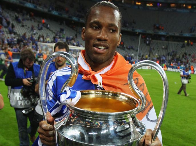 MUNICH, GERMANY - MAY 19: Didier Drogba of Chelsea celebrates with the trophy after their victory in the UEFA Champions League Final between FC Bayern Muenchen and Chelsea at the Fussball Arena München on May 19, 2012 in Munich, Germany. (Photo by Alex Livesey/Getty Images)