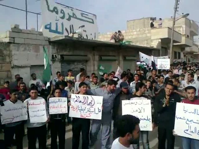 An image grab taken from a video uploaded on YouTube allagedly shows an anti-government demonstration in the Syrian town of Kafrruma in the restive Idlib region near the border with Turkey on May 11, 2012. The European Union is set to slap new sanctions on Syria, imposing an assets freeze and visa ban on two firms and three people, according to EU diplomats