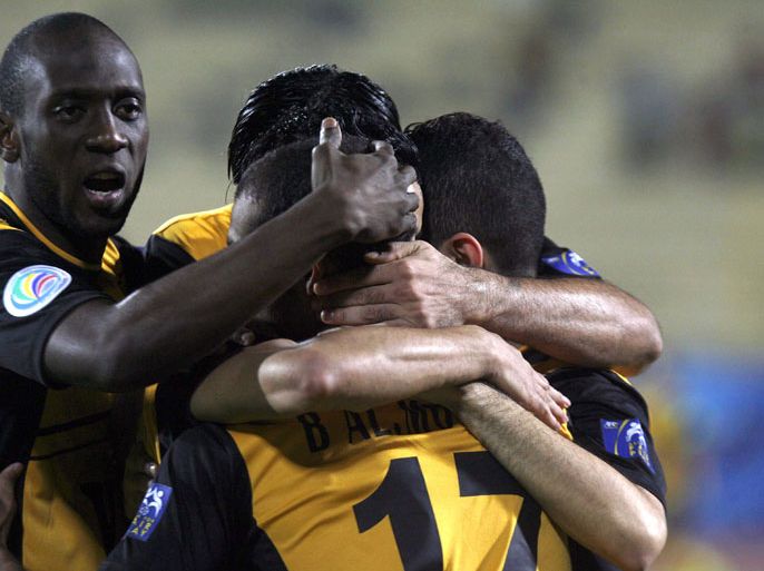 Kuwait's al-Qadsia club players celebrate after scoring a goal against Syria's al-Ittihad club during their 2012 AFC Cup football match in Kuwait City on May 9, 2012. AFP PHOTO/YASSER AL-ZAYYAT