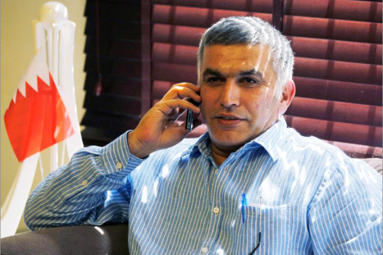 Bahrain human rights activist Nabeel Rajab talks on his mobile phone as a miniature Bahrain Pearl Square monument is seen behind him, upon arriving home in Budaiya, west of Manama, after being detained for over two weeks, May 28, 2012. Rajab, a prominent Bahraini opposition activist accused of organising illegal protests and insulting authorities in the Gulf Arab state, was freed from jail on Monday after being granted bail, his lawyer said. REUTERS/Hamad I Mohammed (BAHRAIN - Tags: CIVIL UNREST SOCIETY POLITICS)