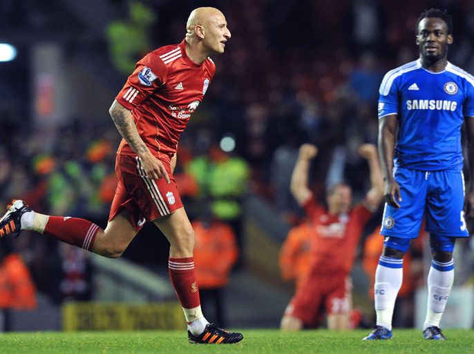 Liverpool's English midfielder Jonjo Shelvey (L) celebrates after scoring the fourth goal during the English Premier League football match between Liverpool and Chelsea at Anfield, Liverpool, north-west England, on May 8, 2012. AFP PHOTO/ PAUL ELLIS. RESTRICTED TO EDITORIAL USE. No use with unauthorized audio, video, data, fixture lists, club/league logos or “live” services. Online in-match use limited to 45 images, no video emulation. No use in betting, games or single club/league/player publications