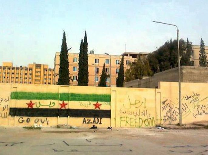 A handout picture released by the Syrian opposition's Shaam News Network shows anti-regime graffiti sprayed on the walls of Aleppo university on April 30, 2012.
