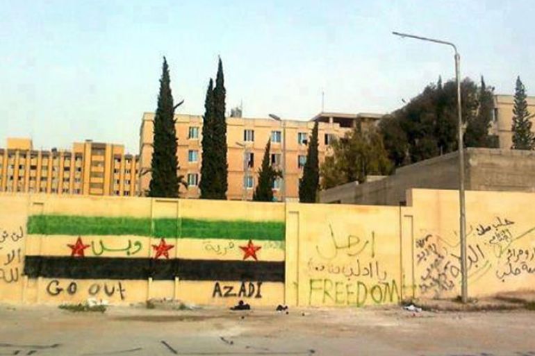 A handout picture released by the Syrian opposition's Shaam News Network shows anti-regime graffiti sprayed on the walls of Aleppo university on April 30, 2012.
