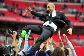 Chelsea's Italian manager Roberto Di Matteo is thrown into the air in celebration by his players after their 2-1 win in the FA Cup final football match between Liverpool and Chelsea at Wembley Stadium in London, England on May 5, 2012. AFP