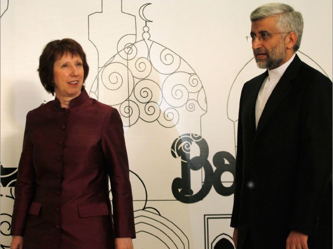European Union Foreign Policy Chief Catherine Ashton (L) walks with Iran's top nuclear negotiator Saeed Jalili before their meeting in Baghdad, May 23, 2012.  REUTERS/Thaier al-Sudani (IRAQ - Tags : - Tags: POLITICS ENERGY)