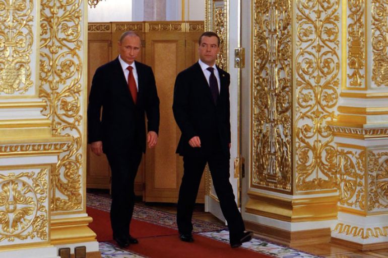 Russian President Vladimir Putin (L) and outgoing President Dmitry Medvedev (R) arrive for a handover ceremony for the 'nuclear case' - control over nuclear strategic forces- after Putin's inauguration in the in the Grand Kremlin Palace, Moscow Russia, 07 May 2012. Russian politician Vladimir Putin was sworn in for a third term as Russia's president on Monday, as the former KGB spy cemented his control over the world's largest country. EPA/MIKHAIL KLIMENTYEV/RIA NOVOSTI/KREMLIN POOL