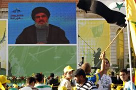 Lebanese Hezbollah Secretary General Hassan Nasrallah addresses supporters via video link during a rally in the southern town of Bint Jbeil on May 25, 2012 to mark the 12th anniversary of the withdrawal of Israeli troops from south Lebanon after a 22-year
