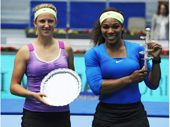 US Serena Williams (R) and Belorussian Victoria Azarenka (L) hold their trophies after their final match of the Madrid Masters on May 13, 2012 at the Magic Box (Caja Magica) sports complex in Madrid. Williams won 6-1, 6-3. AFP PHOTO / JAVIER SORIANO