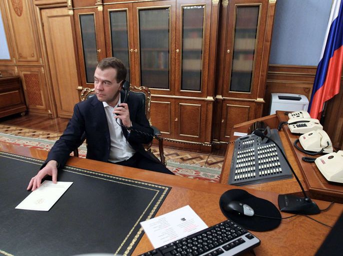 KAD166 - Moscow, -, RUSSIAN FEDERATION : Former Russian president Dmitry Medvedev, who was approved for the post of Russian Prime Minister by deputees in the State Duma, works in his office at the Government House in Moscow on May 8, 2012. Russia's new President Vladimir Putin won today parliamentary approval for his predecessor Dmitry Medvedev to become prime minister, as protesters tried new tactics to keep up pressure on the Kremlin