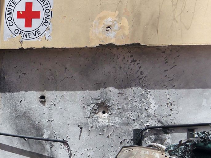 A closeup view shows the damged wall of the offices of the International Committee of the Red Cross in the eastern Libyan city of Benghazi on May 22, 2012, following a rocket-propelled-grenade overnight attack against the organisation which has been present in Libya since an uprising against Moamer Kadhafi erupted in February 2011. AFP PHOTO/ABDULLAH DOMA