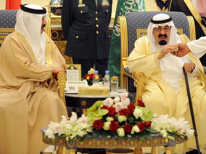 Saudi King Abdullah bin Abdul Aziz (R) receives a cup of Arabic coffee as he sits with his Bahraini counterpart Hamad bin Issa al-Khalifa during a welcoming ceremony for leaders from the Gulf Cooperation Council (GCC) on May 14, 2012 at an airbase in the capital Riyadh. Gulf leaders gathered in the desert kingdom to discuss developing their six-nation council into a union, a Saudi proposal likely to start with the kingdom and unrest-hit Bahrain. AFP