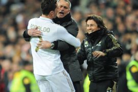MADRID, SPAIN - FEBRUARY 12: Cristiano Ronaldo (L) of Real Madrid celebrates scoring his sides second goial with head coach Jose Mourinho of Real Madrid during the la Liga match between Real Madrid and Levante at Estadio Santiago Bernabeu on February 12, 2012 in Madrid, Spain. (Photo by Jasper Juinen/Getty Images)