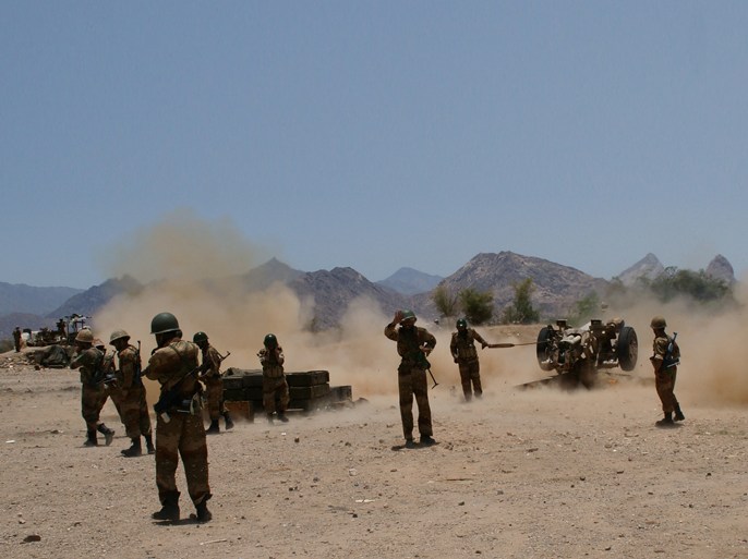 Yemeni army soldiers fire an artillery at Al-Qaeda militants' positions near the southern town of Loder, in Abiyan province, on April 30, 2012 where at least 21 people, including 18 Al-Qaeda militants were killed. Loder lies 150 kilometres northeast of Zinjibar, capital of Abyan province, which was seized last May by the Partisans of Sharia (Islamic law), an affiliate of Al-Qaeda in the Arabic Peninsula. AFP