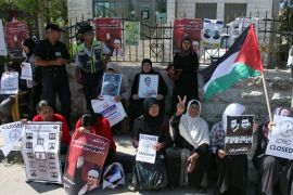 Dozens of Palestinian women sit outside the building of the Red Cross in the West Bank town of Al-Bireh, near Ramallah, on May 10, 2012 during a protest calling the Red Cross to intervene for the release of hunger-striking Palestinian prisoners in Israeli jails. More than a third of the 4,700 Palestinian prisoners held by Israel are currently observing an open-ended hunger strike to demand improved conditions, including family visits