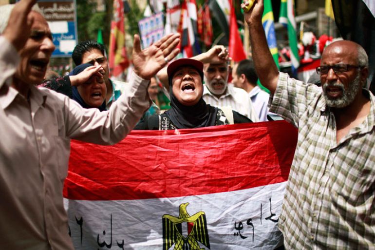 People shout during a protest against candidate Ahmed Shafiq at Tahrir Square in Cairo May 25, 2012. The prospect of Shafiq succeeding Hosni Mubarak as president of Egypt is a nightmare for revolutionaries and Islamists, but a security blanket for those wary of change