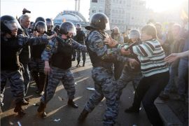 Russian Police officers detain opposition supporters during a rally in Moscow on May 6, 2012. Russian riot police Sunday violently clashed with protesters at a rally on the eve of strongman Vladimir Putin's return for a third Kremlin term, arresting over 250 people including opposition leaders. AFP PHOTO / ANDREY SMIRNOV