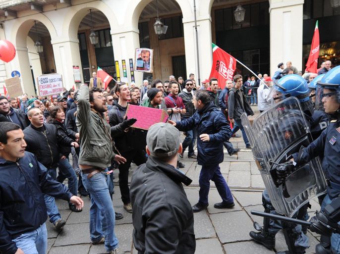 Police block protesters who challenge the Mayor of Turin, Piero Fassino (not in picture), during International World Labor Day celebrations in Turin, Italy, 01 May 2012. EPA/ALESSANDRO DI MARCO
