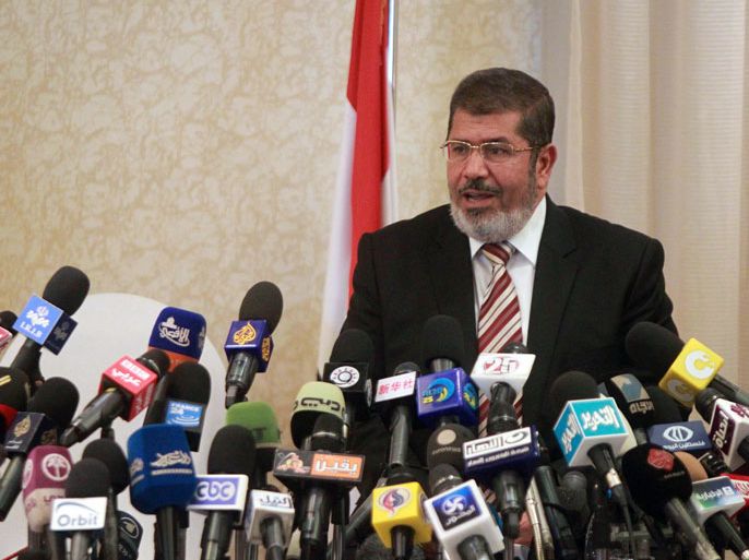 Cairo, -, EGYPT : Egyptian Muslim Brotherhood candidate for the presidential elections Mohammed Mursi holds a press conference in Cairo on May 29, 2012. Egypt's cabinet is to meet on May 29, after a presidential election turned violent when protesters torched the offices of Ahmed Shafiq, the runoff candidate from the regime of ousted president Hosni Mubarak. AFP PHOTO/KHALED DESOUKI